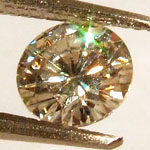moissanite gemstone with green sparkle