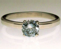 blue lab-grown diamond in a platinum setting