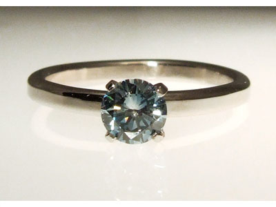 man made blue diamond engagement ring in platinum